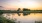 reflections on a pond at sunset